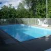 Both ends of the pool were resurfaced and the water depth adjusted for safety.  Water lines and drains were updated.